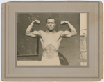 Studio portrait of New York City fire fighter Wesley A. Williams in a body building pose