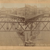 Elevated railroad tracks and station