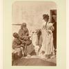 Charity; stylishly dressed woman giving alms to peasant
