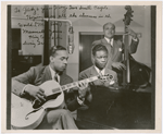 Group portrait of King Cole Trio, (left to right) Oscar Moore (guitar), Nat King Cole (piano) and Leslie Prince (double bass), during a broadcast on NBC Radio, circa 1940