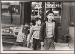 Children near plumbers' shop, New York City