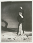 Carmen Amaya posing in a long velvet skirt and bolero jacket