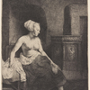 Woman sitting half dressed beside a stove