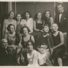 Mary Wigman seated in a group of nine other women and two men, no others identified, at Hotel Bristol
