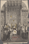The Queen on the throne receiving the speech from the Lord Chancellor.