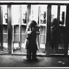 Woman and telephone booths