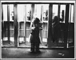 Woman and telephone booths