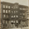 Ivy covered brownstones; boulevard type lamp