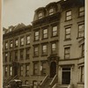 Brownstones and brick row house; Stanley Steamer automobile (?)