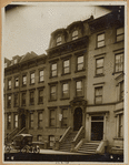 Brownstones and brick row house; Stanley Steamer automobile (?)