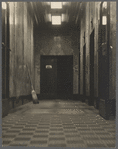 Office building lobby with broom & elevator