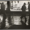 Shop window and passers-by.