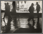 Shop window and passers-by.