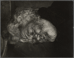 Vagrant asleep on sidewalk, NYC.