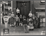 Group of children playing in a doorway