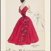 Full-length dress with off-the-shoulder neckline and very wide shawl collar whose decoration continues down the back as a large, embroidery-trimmed ruffle 