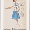 Pleated skirt and middy blouse; middy has contrast trim and embroidered emblem