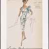 Print chiffon cocktail dress with draped neckline, asymmetric bodice and gather at left hip; fitted at back