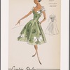 Print cocktail dress with sweetheart bodice and contrast draped neckline of chiffon; gores and contrast bow decorations on skirt
