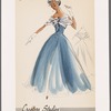 Evening gown with lace yoke and capelet decorated with corsage; sheer overdress