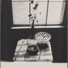 Still life: glass vase, dish of lemons.