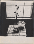 Still life: glass vase, dish of lemons.
