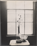 Still life: glass vase, dish of lemons.