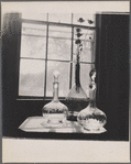 Still life: three glass bottles.
