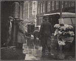 Policeman and flower vendor on a rainy street