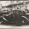 Crowd watching a celebrity (?) exiting a car