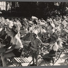 French kids with Indian head-dresses.