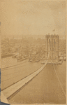 View of Manhattan waterfront and Brooklyn Bridge under construction; temporary footbridge 