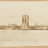 View of Brooklyn waterfront and Brooklyn Bridge under construction; temporary footbridge visible