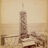 The obelisk "Cleopatra's Needle" surrounded by scaffolding with workers at top