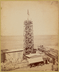 The obelisk "Cleopatra's Needle" surrounded by scaffolding with workers at top