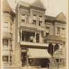 Woodframe & shingled Victorian houses with Cigar & Stationary storefront