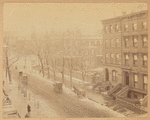 Row houses and horse carriages in the snow