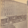 Workers outside warehouse buildings: Faile Williams & Co., Bodine & Co.