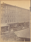 Workers outside warehouse buildings: Faile Williams & Co., Bodine & Co.