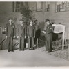Group portrait of security officers at Riverton Houses administration office, in Harlem, New York City