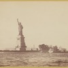 Statue of Liberty from the harbor, ferry, outbuildings