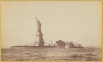 Statue of Liberty from the harbor, ferry, outbuildings