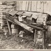 Primitive chicken roost, carved out of hollow log, on farm of rehabilitation client, Boone County, Arkansas