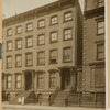 Brownstone row houses and town house; woman with children