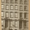 Brownstone row houses with stoops