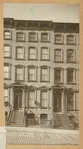 Brownstone row houses with stoops