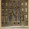Brownstone row houses with stoops