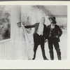 Scene from the motion picture Call of Her People (bride and two men standing)