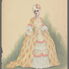 Woman in yellow, white, and pink dress