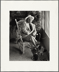 Portrait of Tennessee Williams reclining in chair